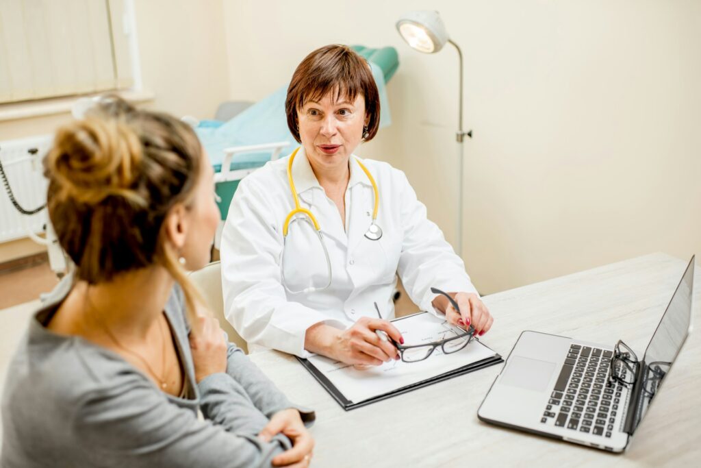 A woman visiting her doctor (Getty Images)